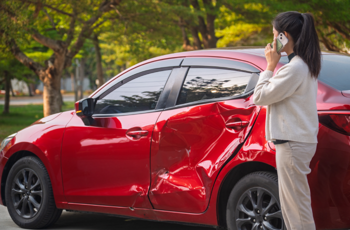 Car accident. Young Asian woman after car accident.