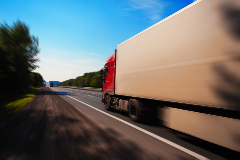 a truck is driving down the road