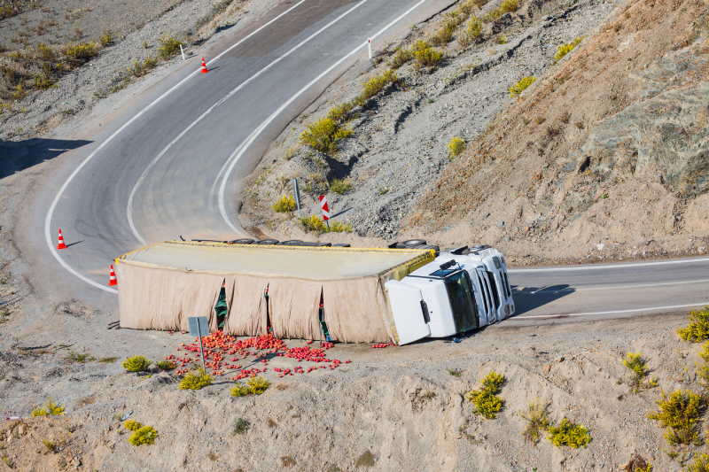 Truck accident. Truck lies on the road after incident.