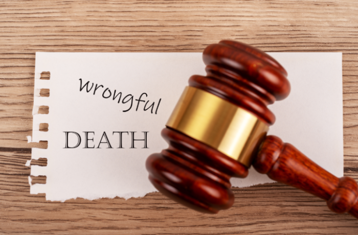 Judge gavel over wrongful death text, legal lawsuit, justice and compensation concept.